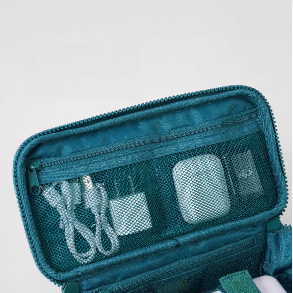 Mesh pocket design for storing cables and small accessories.