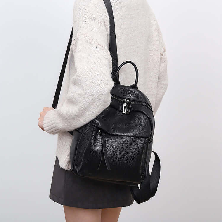 model wearing mini leather backpack for daily use