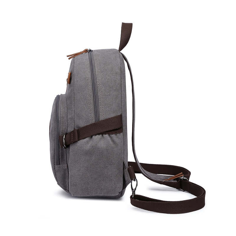 Mini canvas sling backpack side profile with PU leather accents