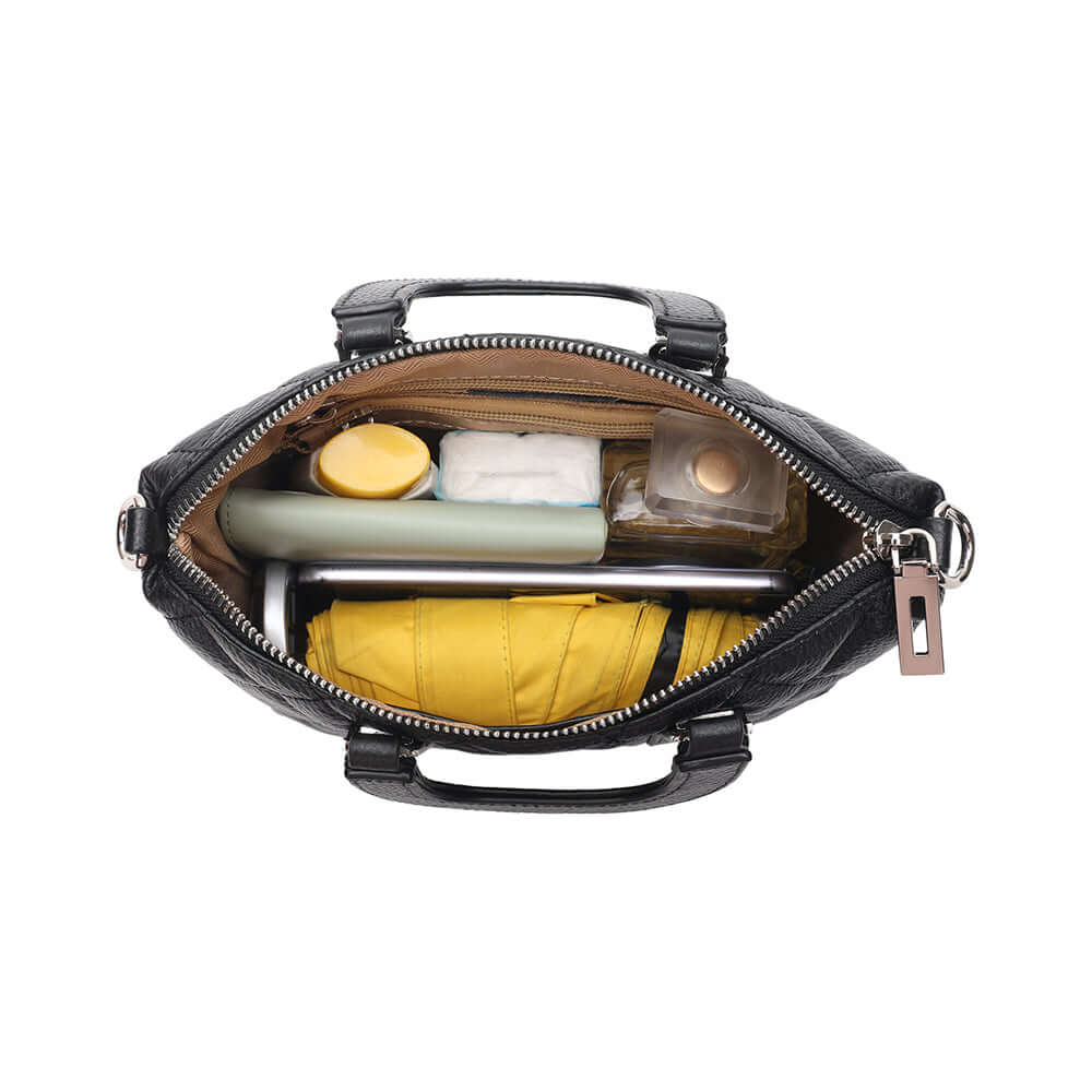 Internal pockets and lining of leather mini handbag