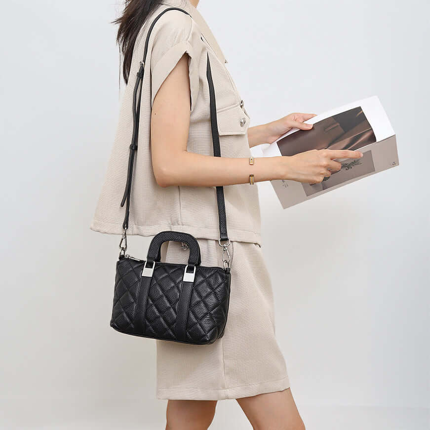 mini leather handbag worn as shoulder bag