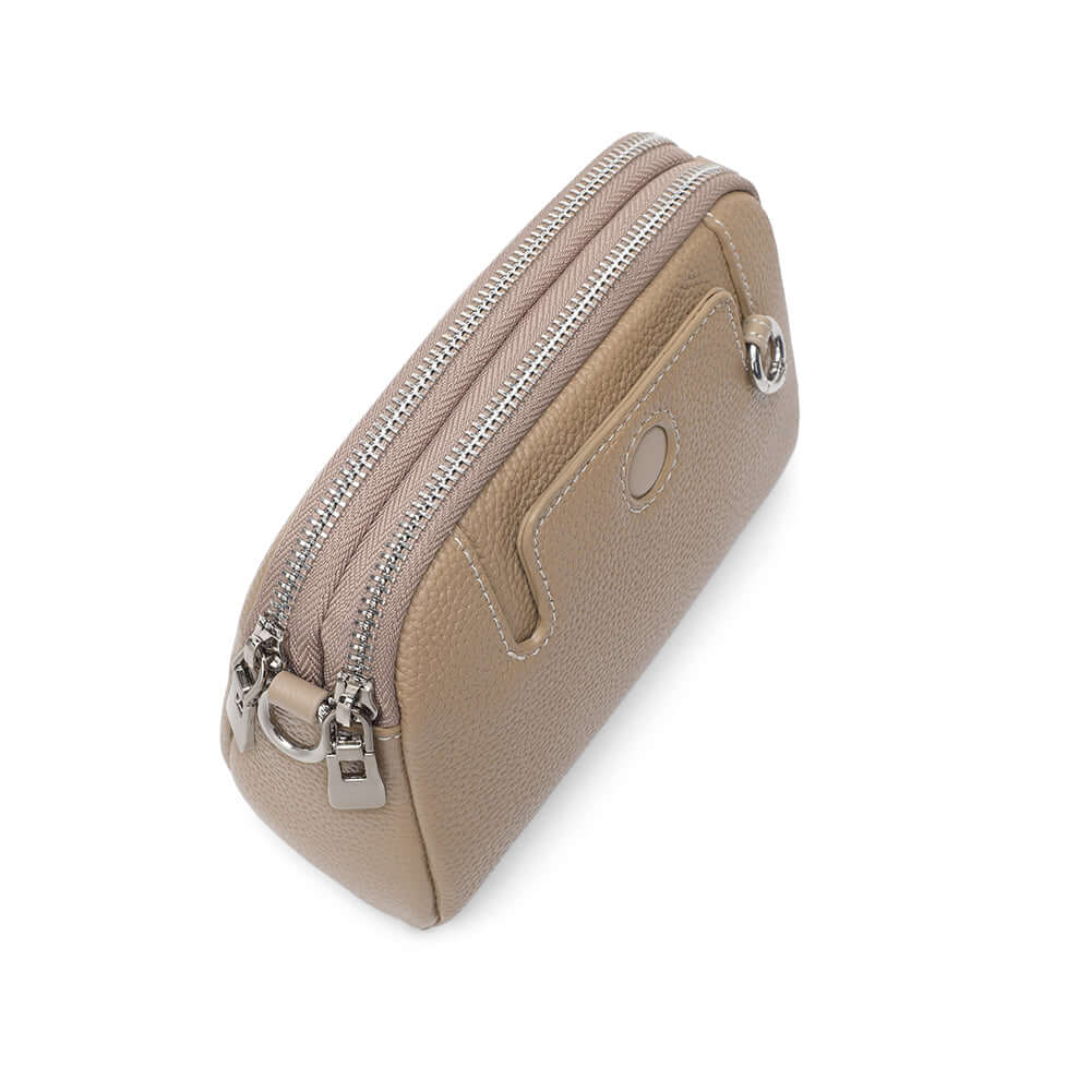 Mini leather crossbody bag metal hardware with smooth zipper finish.