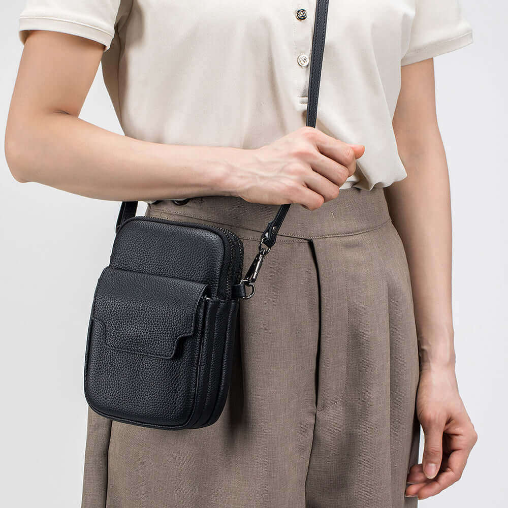 Minimalist leather crossbody bag for daily use, crafted from soft leather for comfort.