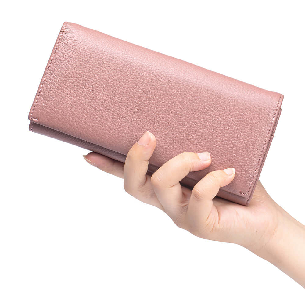 Pink wallet held by a hand