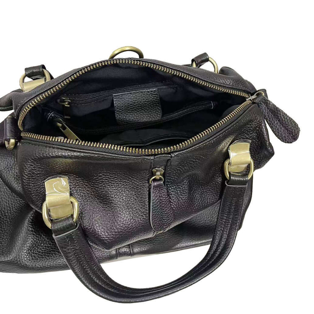 Practical black leather backpack for women with adjustable and detachable straps.