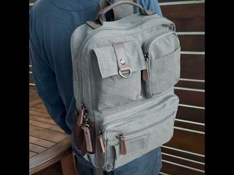 Canvas backpack with dedicated laptop compartment, suitable for carrying a 14-inch laptop and other essentials.