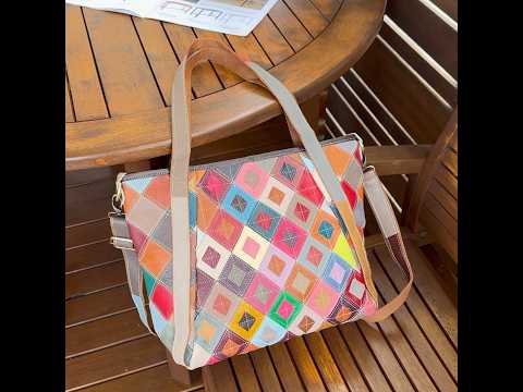 Colorful leather tote bag with adjustable strap for crossbody wear.