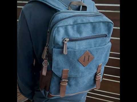 Versatile canvas backpack front view with multiple pockets and stylish design.