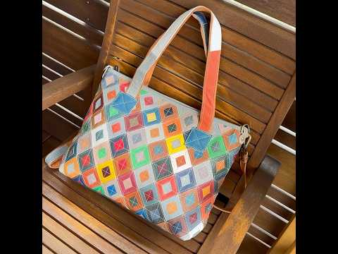 Adjustable straps of the colorful leather tote bag for versatile use.