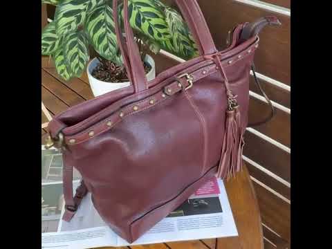 Woman wearing leather shoulder bag crossbody