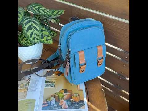 Lightweight canvas backpack worn as crossbody sling
