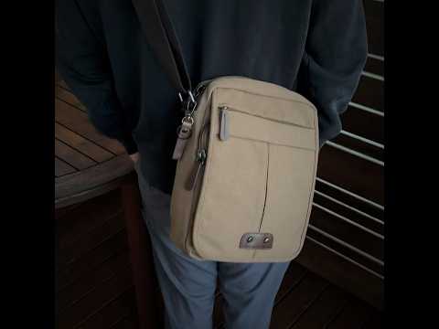 Small canvas messenger side bag front view showcasing its durable construction