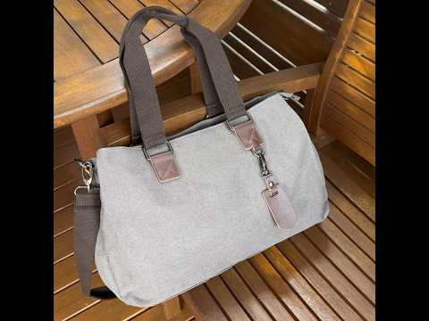 Canvas tote bag for women with three zippered compartments, offering ample storage space.