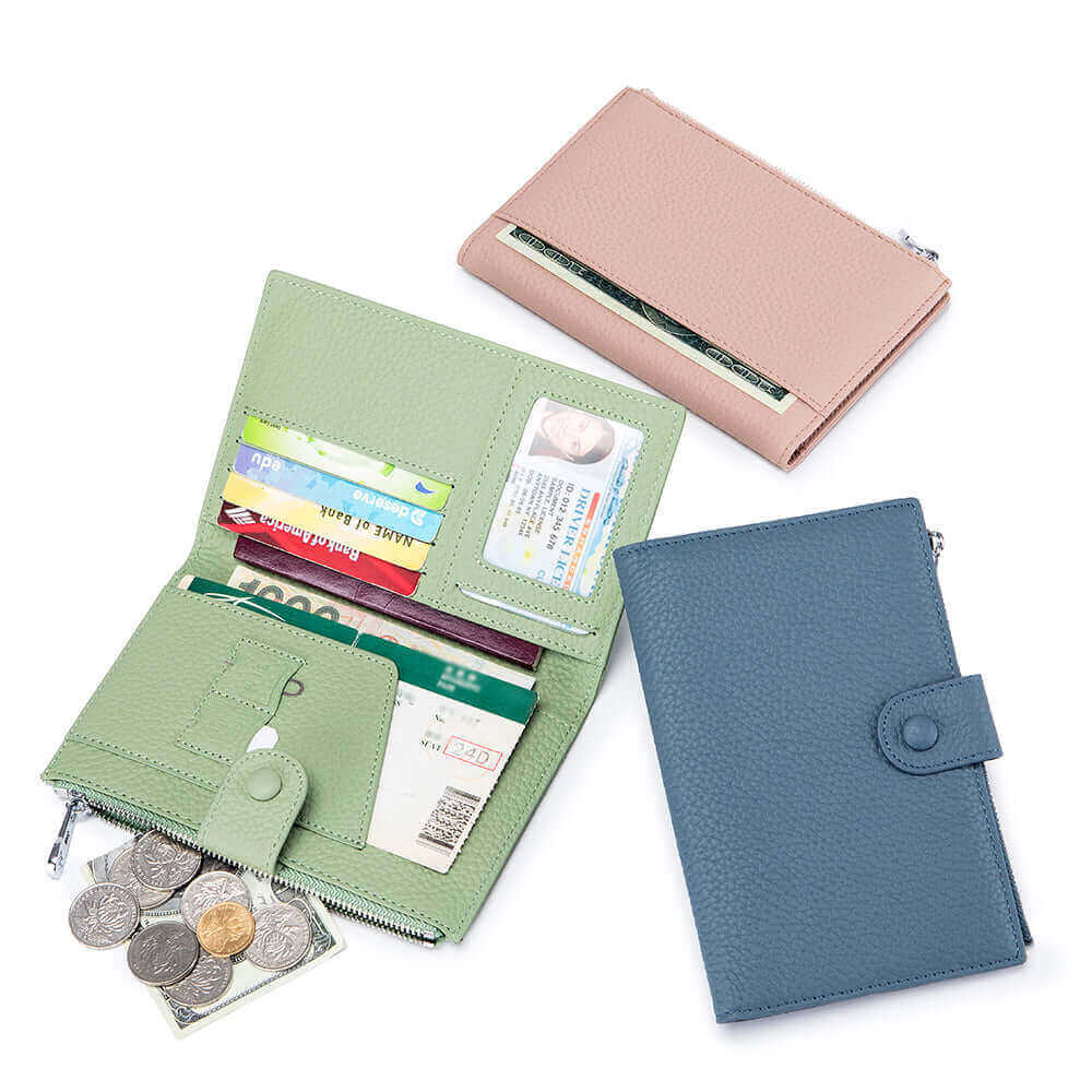 Assorted colors of RFID-protected leather passport wallets laid flat.