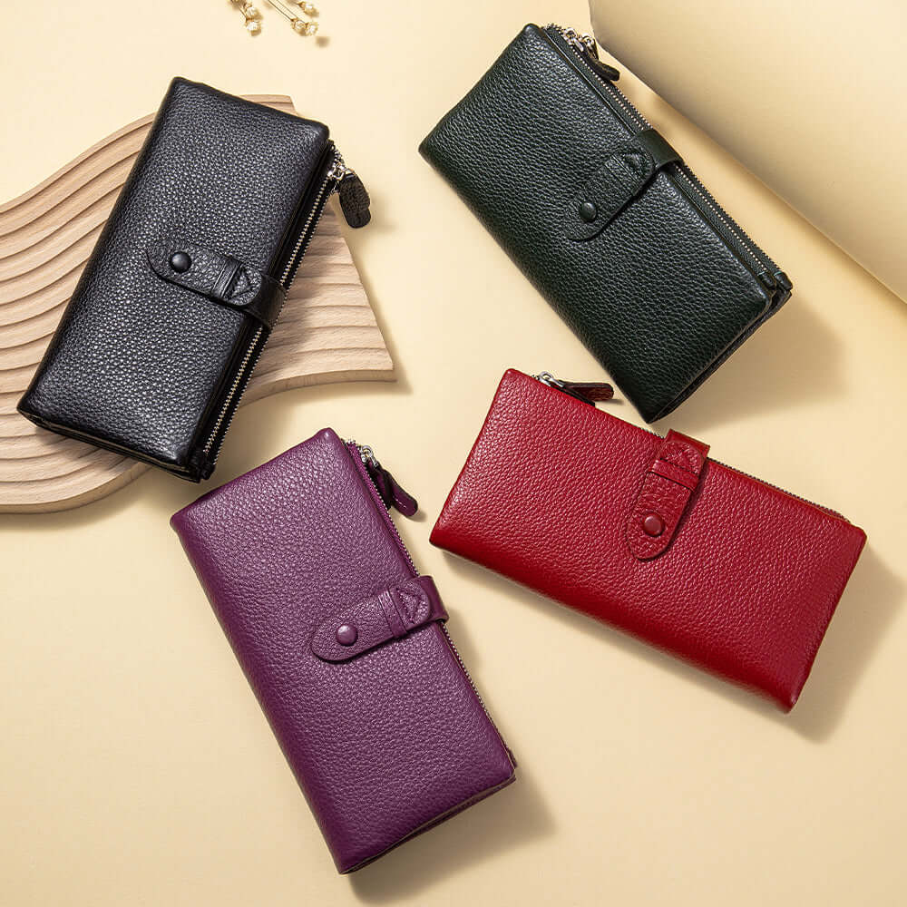 Four leather wallets in black, purple, and red