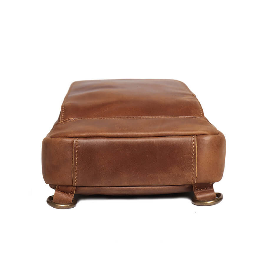 Angled view of slim leather sling bag