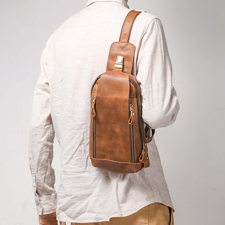 model wearing leather sling bag on back crossbody