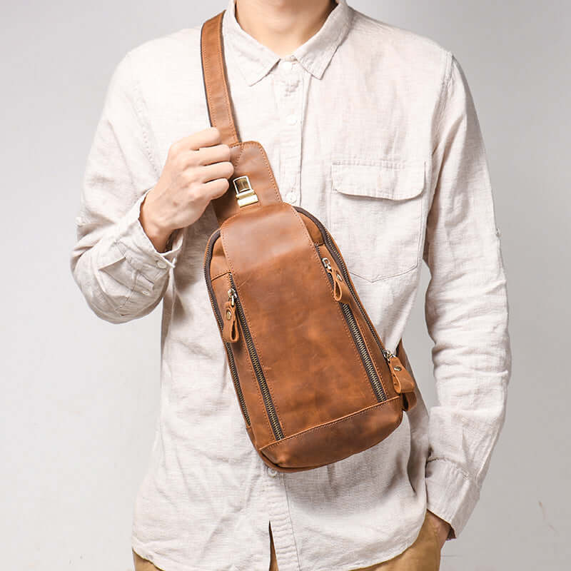 model wearing leather sling bag on front vintage style