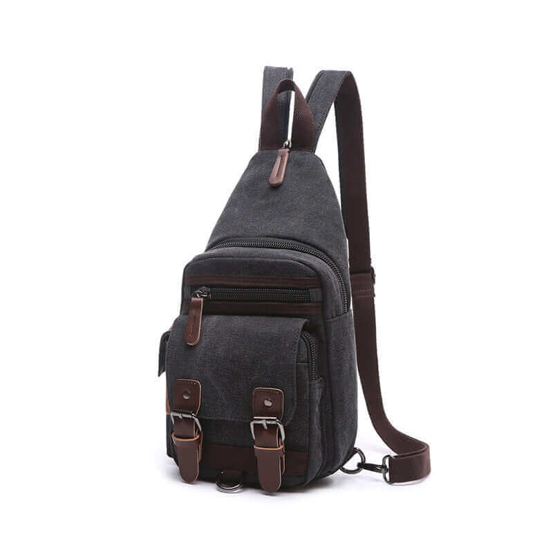 Small canvas sling backpack for travel, offering practical organization and storage.