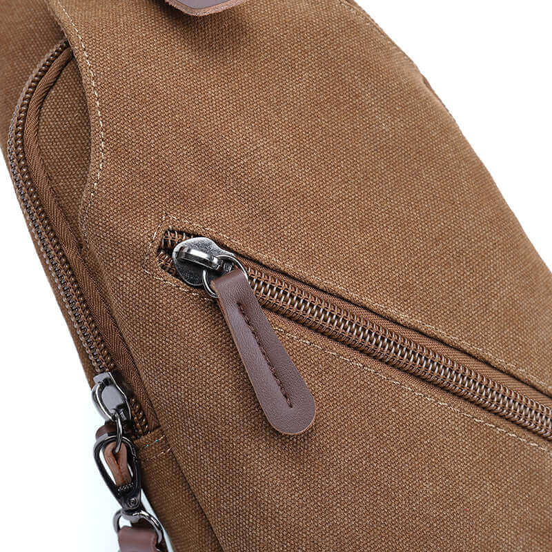 Details of the small canvas crossbody sling bag.