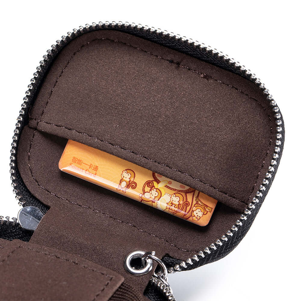 Open view showing lining and inner elastic straps of pouch.