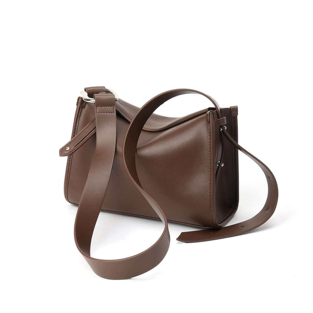 Women's soft leather shoulder bag front view showcasing minimalist design.