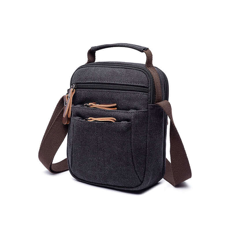 Stylish black canvas shoulder bag with multiple zippered pockets for daily essentials.