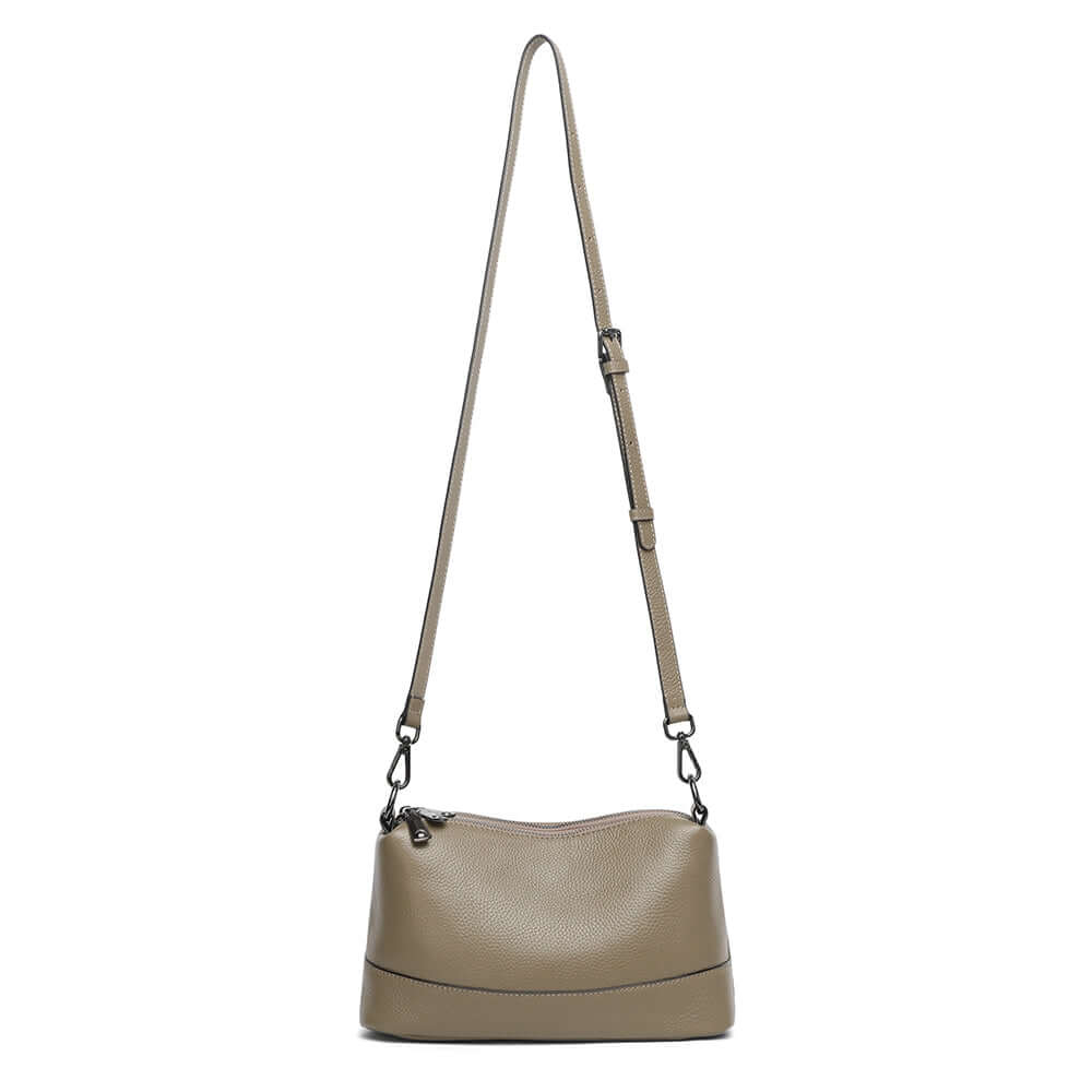 Taupe leather bag with long crossbody strap.