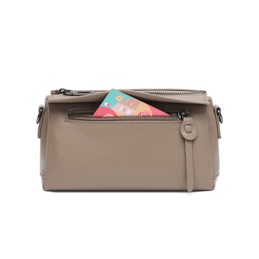 Front view of the taupe leather crossbody bag.