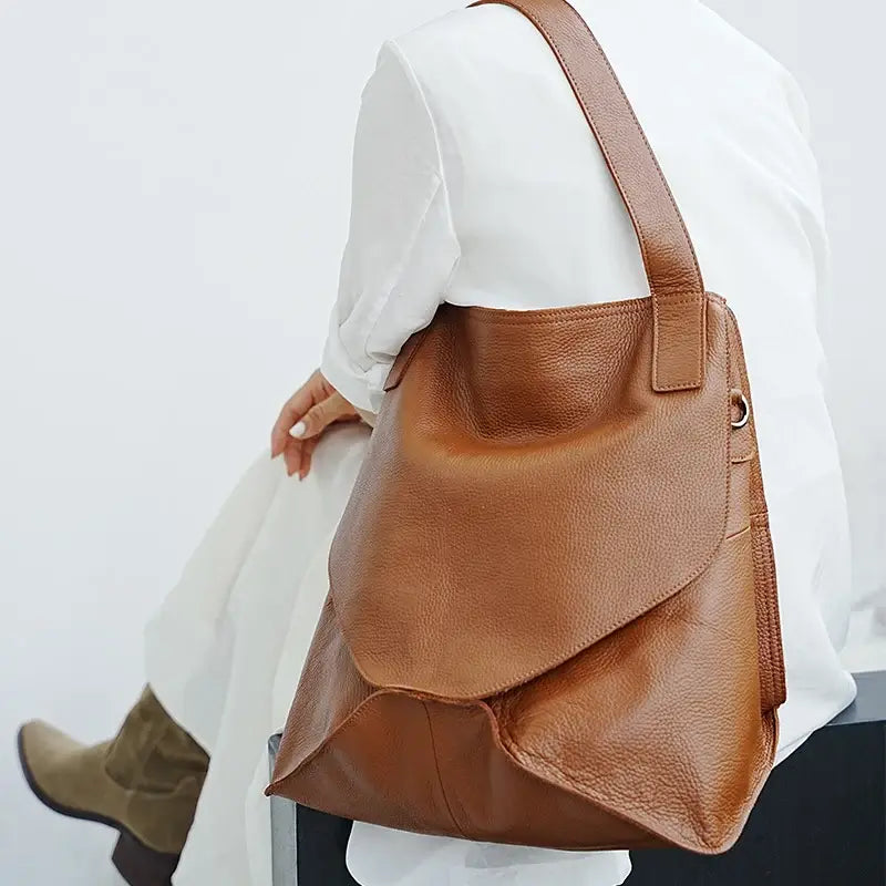 Casual shoulder carry with built-in strap