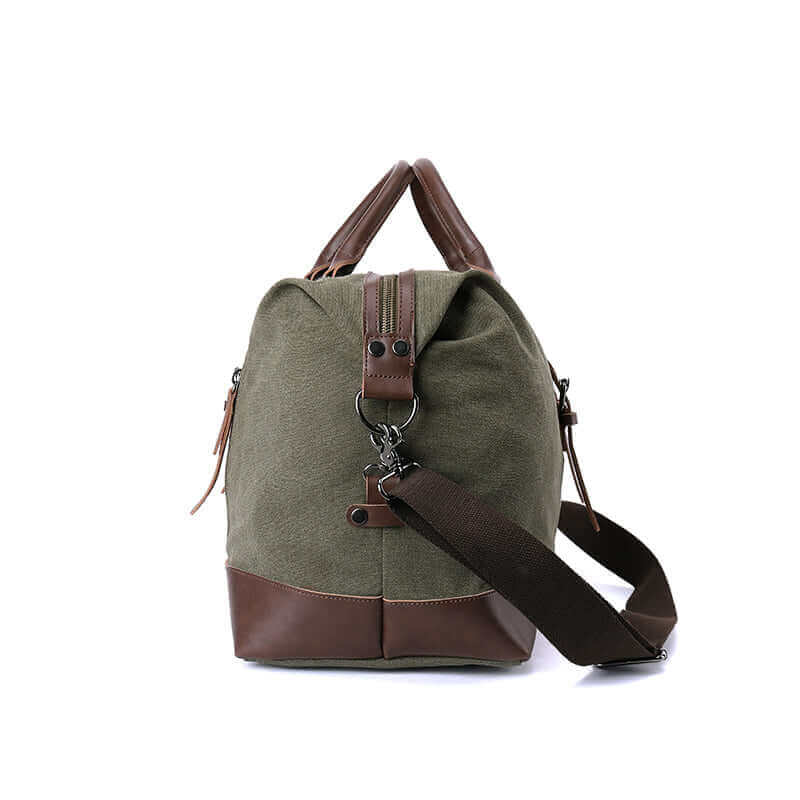 Side view of the green canvas travel duffle bag.