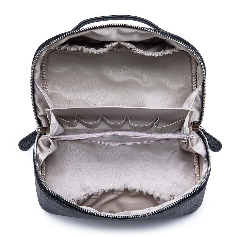 Inside compartments of leather cosmetic case