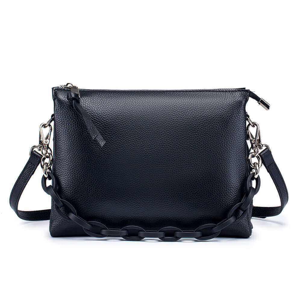 Versatile women's leather handbag for shoulder or crossbody wear.