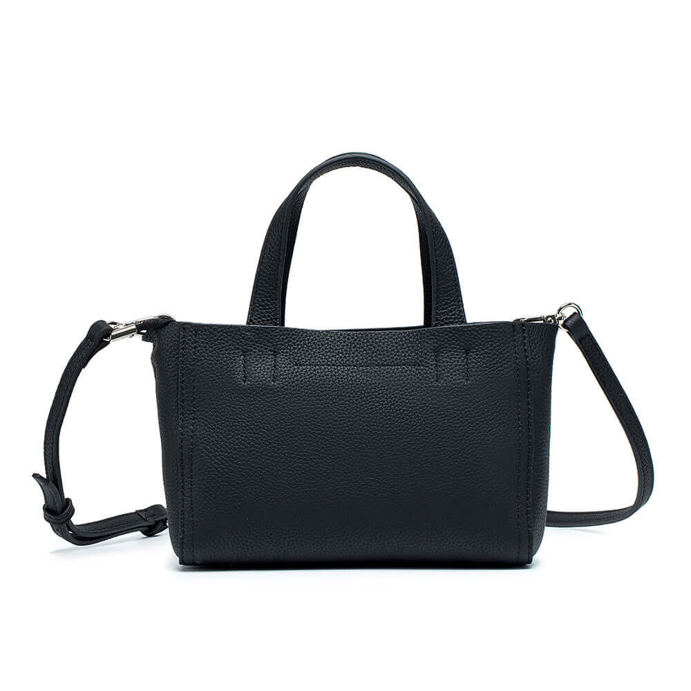 Back view of black leather mini handbag – compact design with detachable strap.