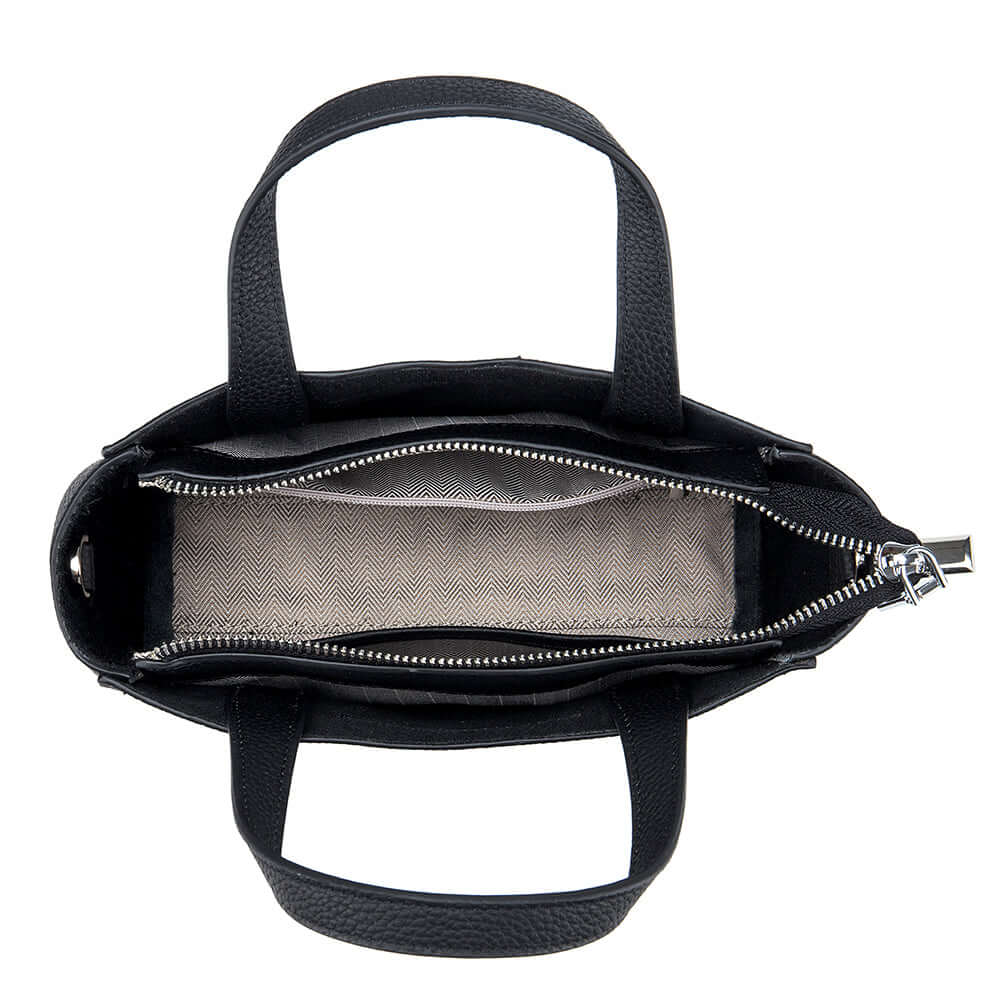 Top view of versatile leather mini handbag – dual handles and zipper closure.