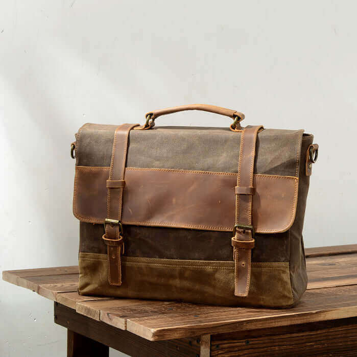 Men's vintage leather and canvas laptop messenger bag, ideal for work and casual wear.