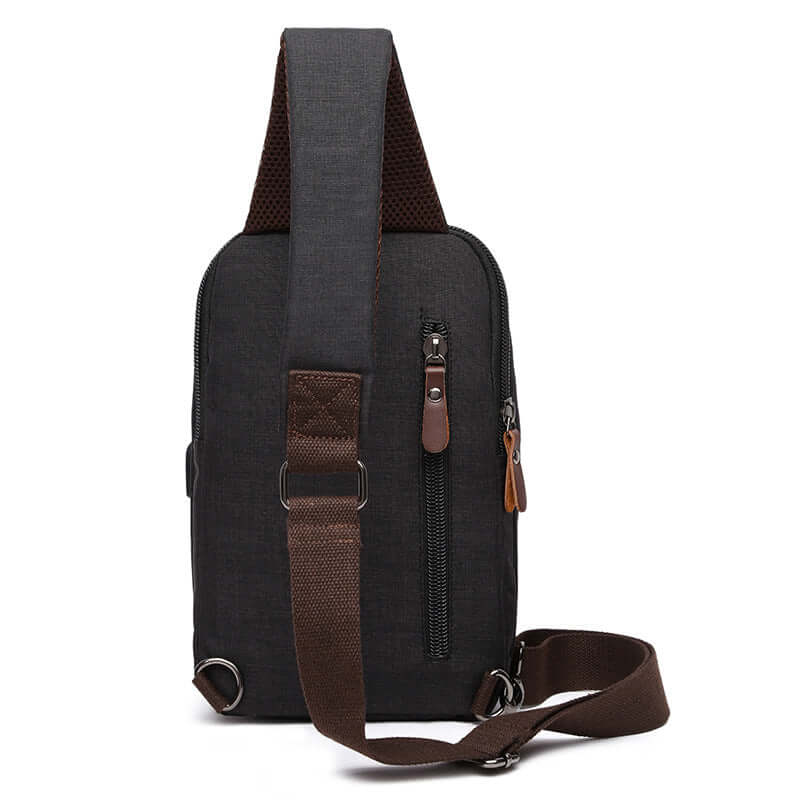 Back view of the black waterproof sling bag highlighting the ergonomic strap.