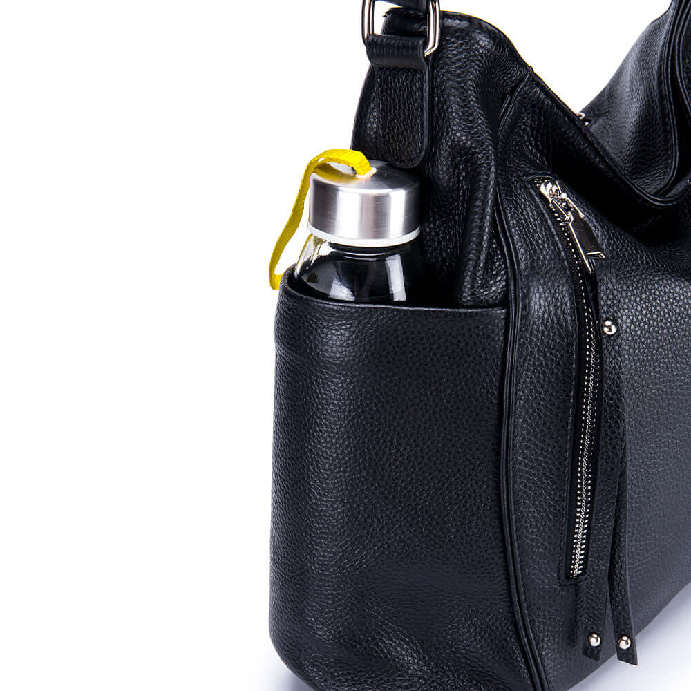 Detailed look of the black genuine leather shoulder bag.