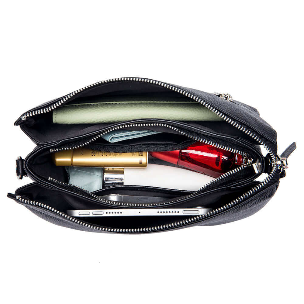 Internal structure display of a women's blacl genuine leather handbag.