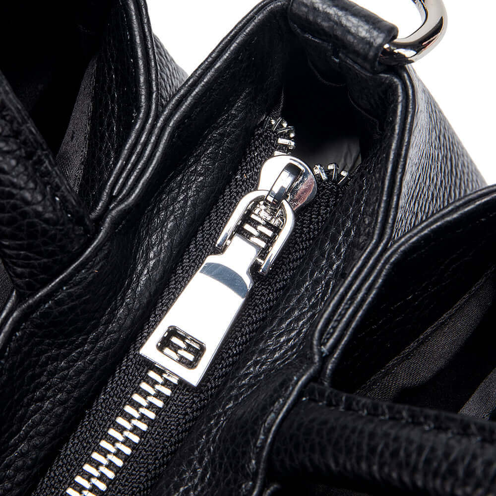 Detailed display of women's genuine leather shoulder bag.