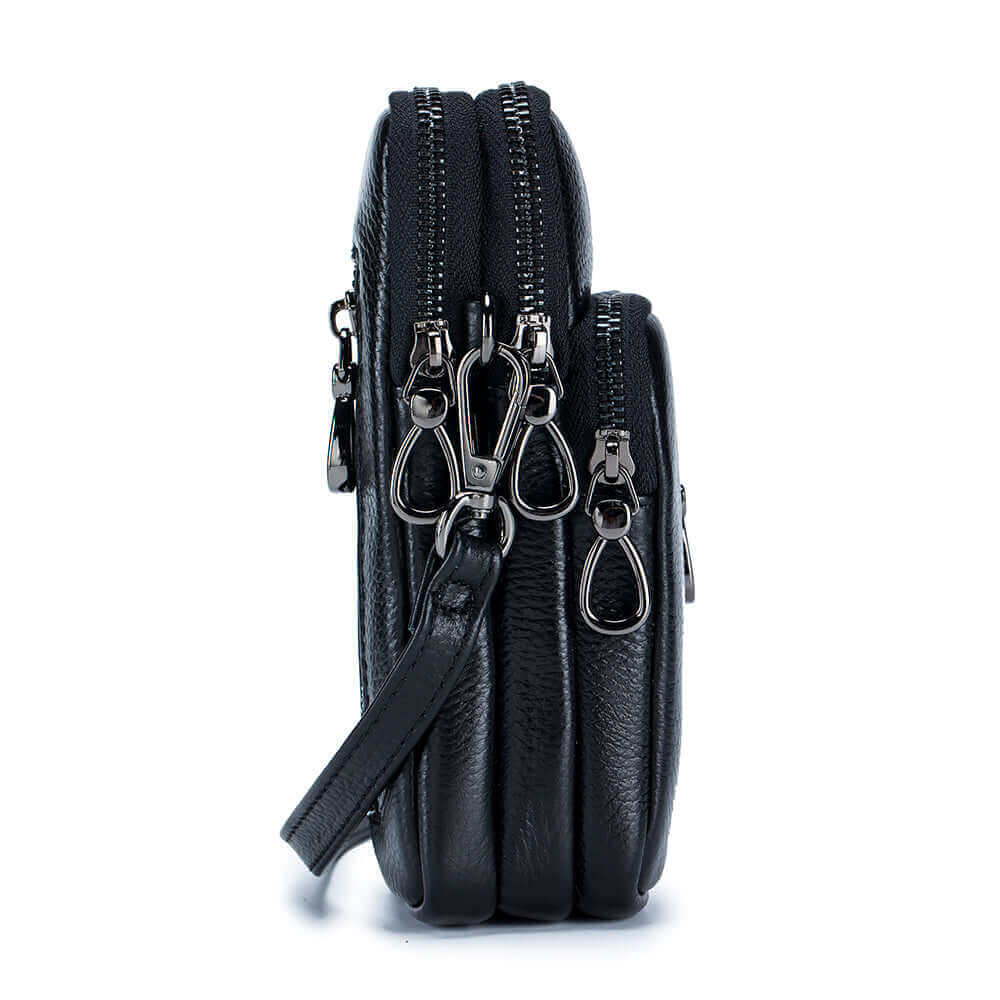 Side view of the women's black leather mini crossbody bag.