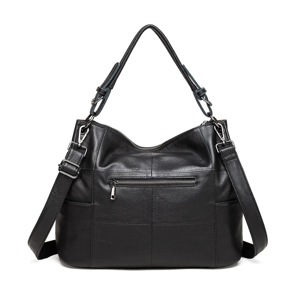 Black leather handbag with multiple pockets and straps