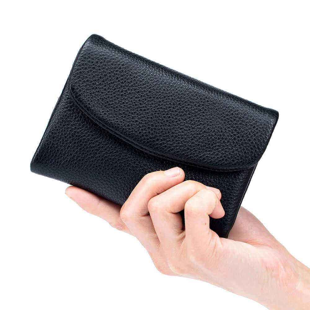 Closed black leather envelope wallet, compact and stylish.