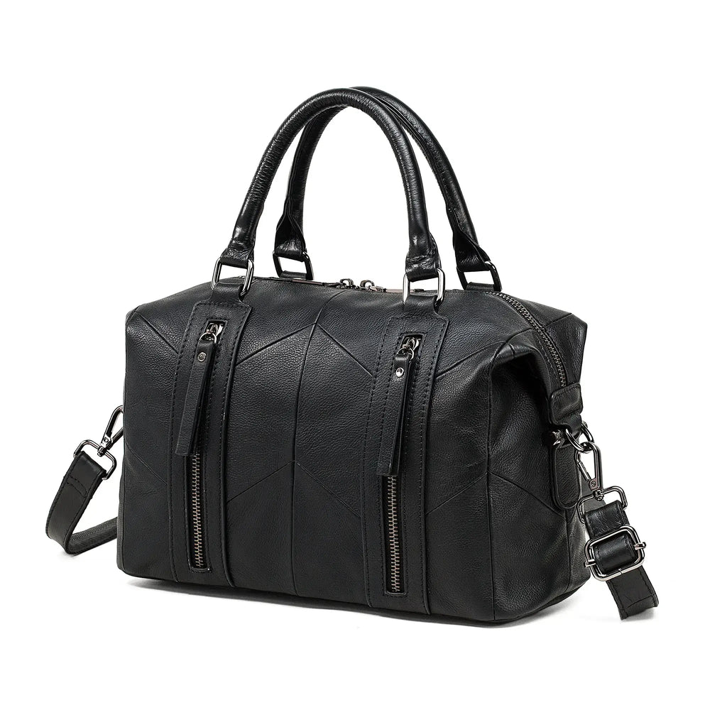 Front view of black genuine leather handbag with zipper detail