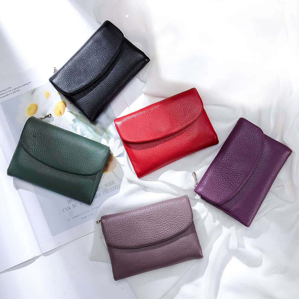 Women's luxury leather envelope wallet with multiple compartments.