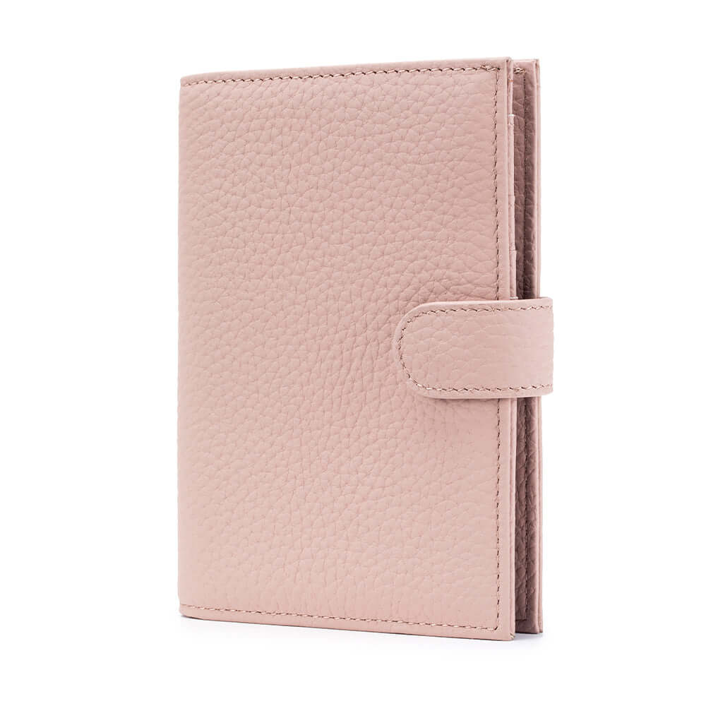 Women's travel leather passport wallet in pink.