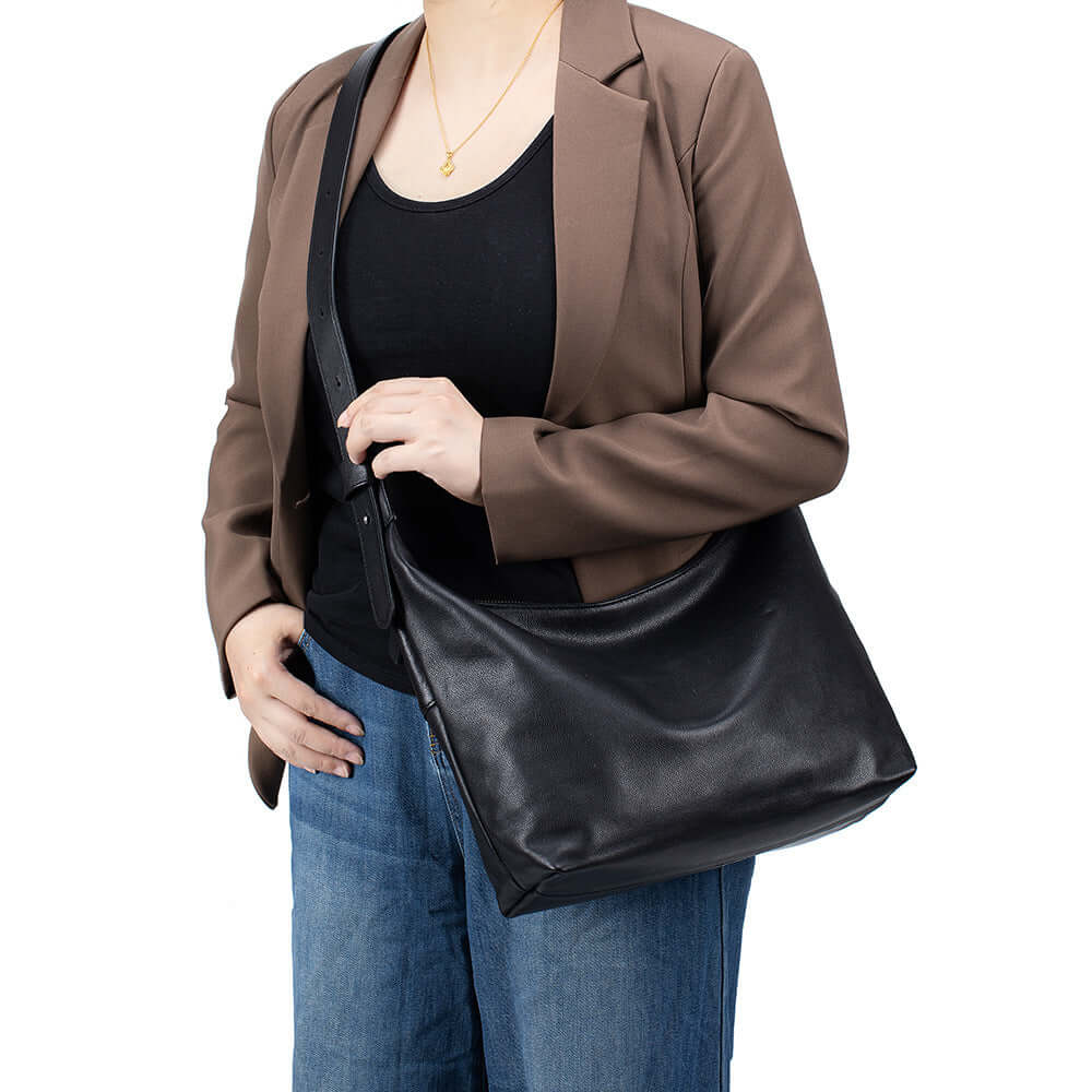 Black soft leather crossbody bag for women.
