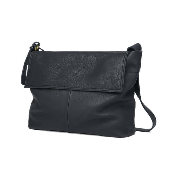 Front view of women's black leather crossbody bag with adjustable strap.