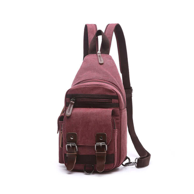 Women's canvas sling bag, designed for casual use with multiple zippered compartments.