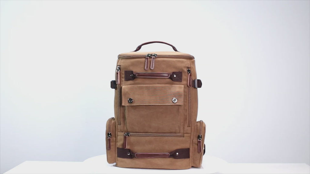 Canvas laptop backpack featuring multiple zippered pockets for organized storage.